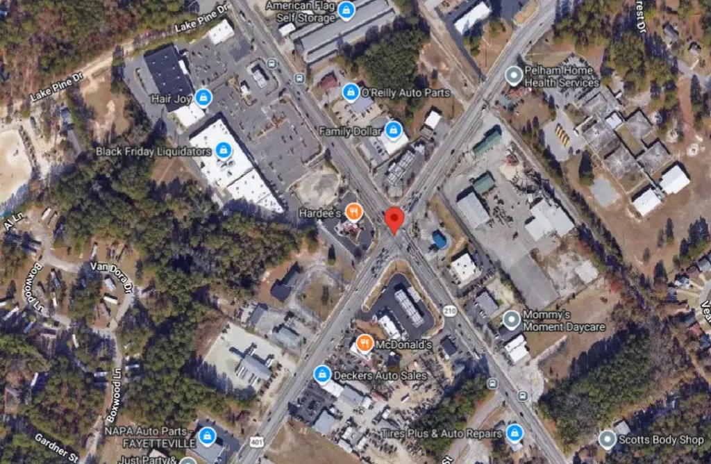 Fayetteville, NC Accident Leaves Pickup Truck Perched on Retaining Wall